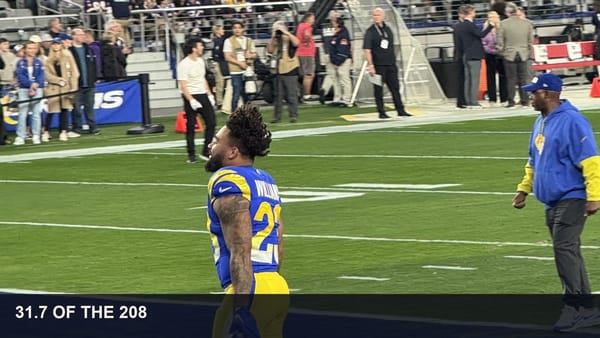 Kyren Williams in a Rams uniform on the field during an NFL playoff game